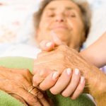 Nurse helping an elderly woman