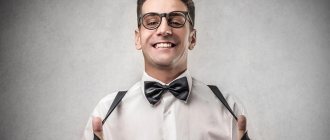 A man in a white shirt, bow tie, suspenders, glasses