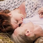 Guy and girl lying on the grass